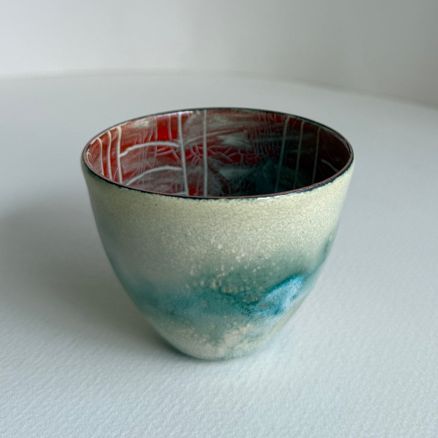 small decorative vessel in copper and enamel