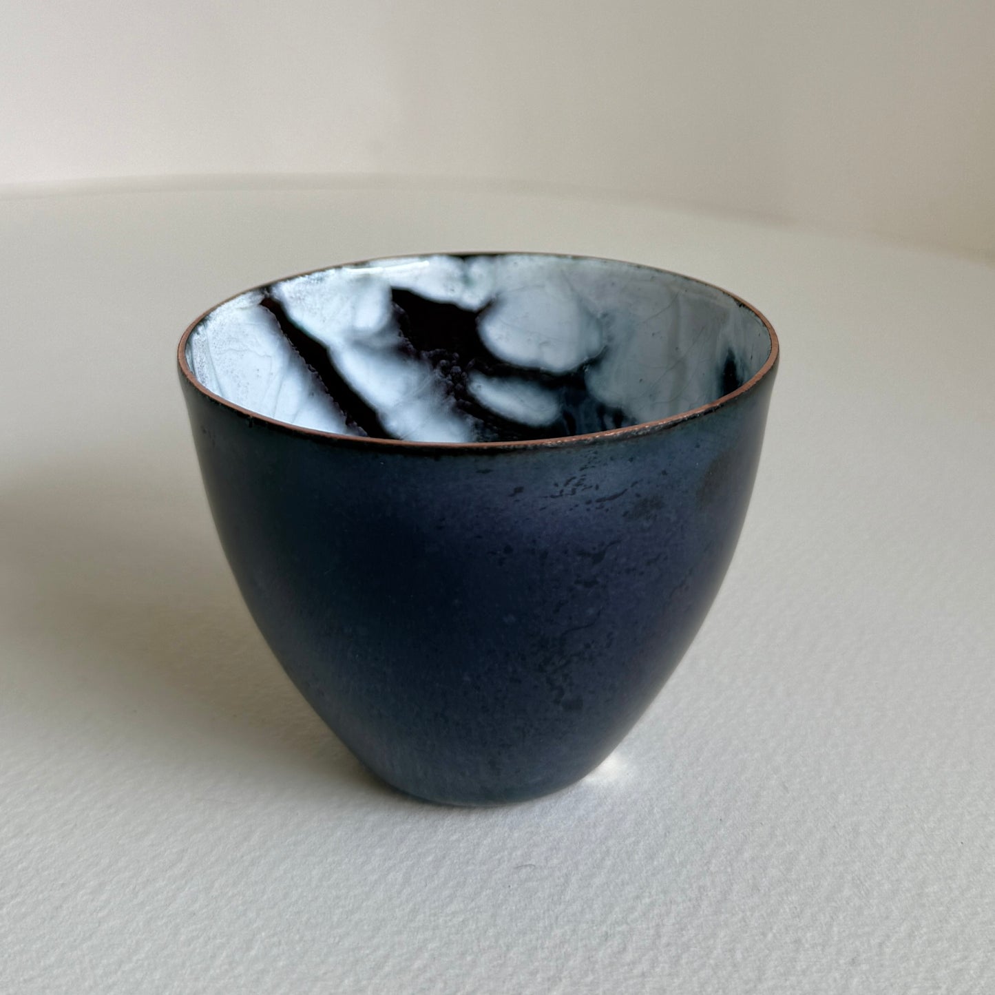 small decorative vessel in copper and enamel