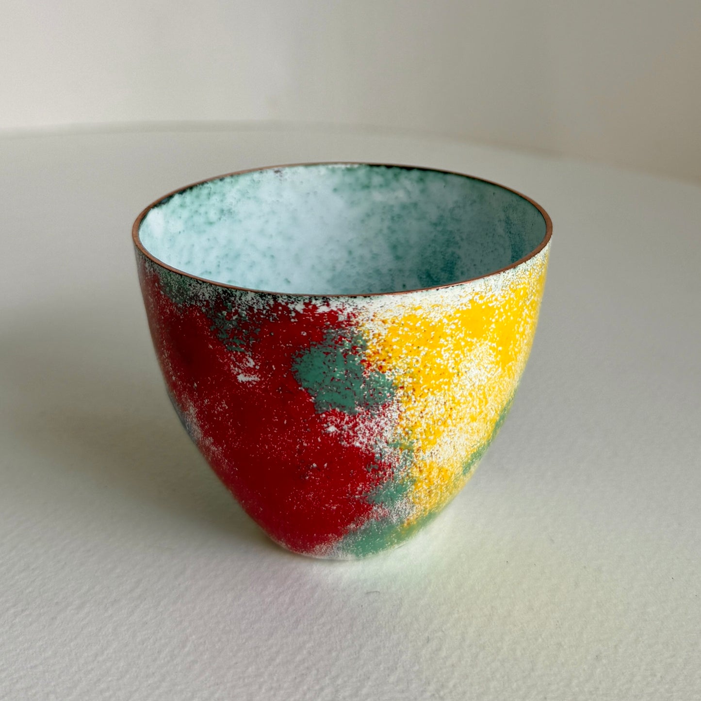 small decorative vessel in copper and enamel