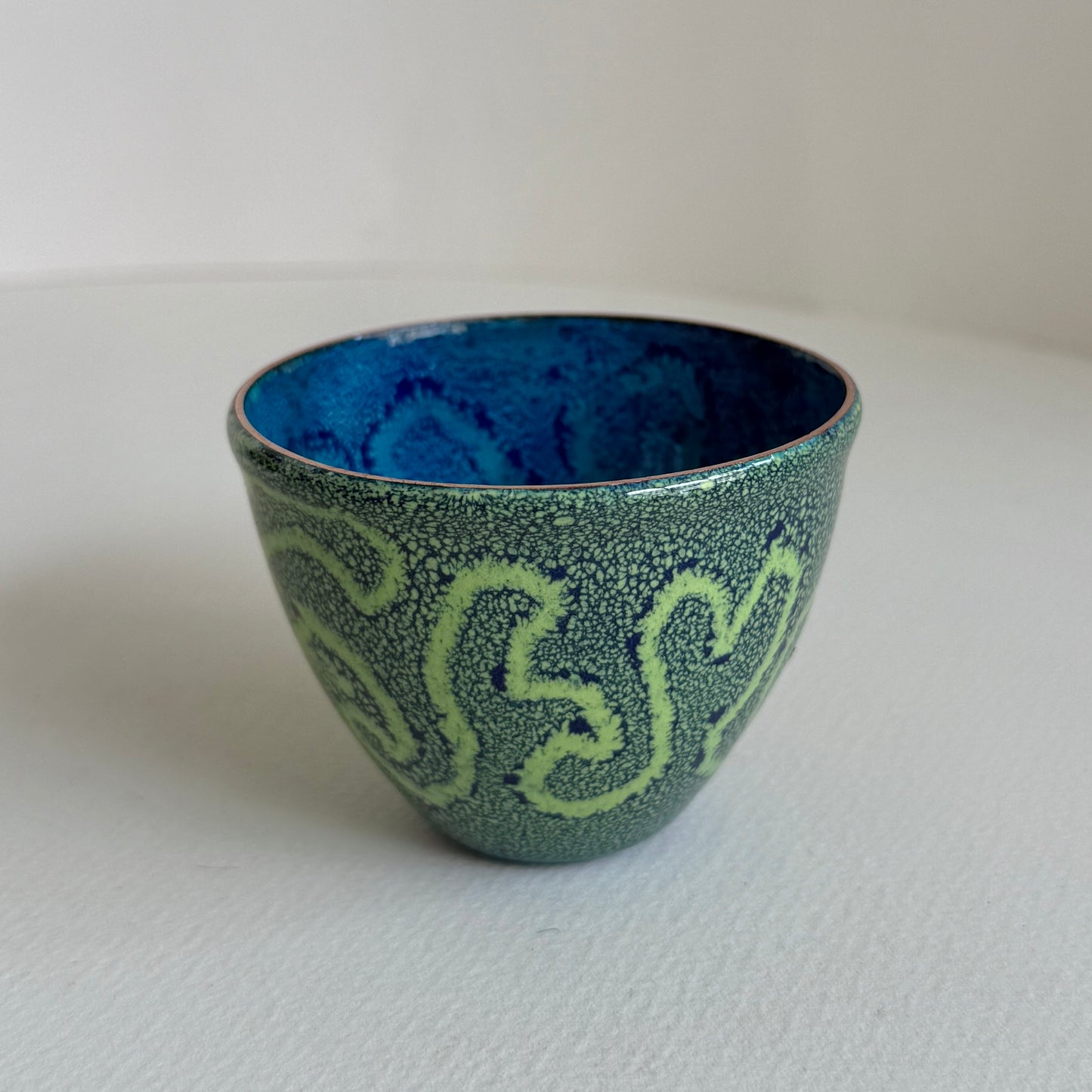 small decorative vessel in copper and enamel