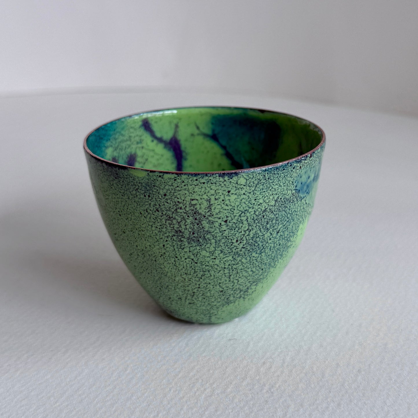 small decorative vessel in copper and enamel