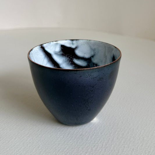 small decorative vessel in copper and enamel