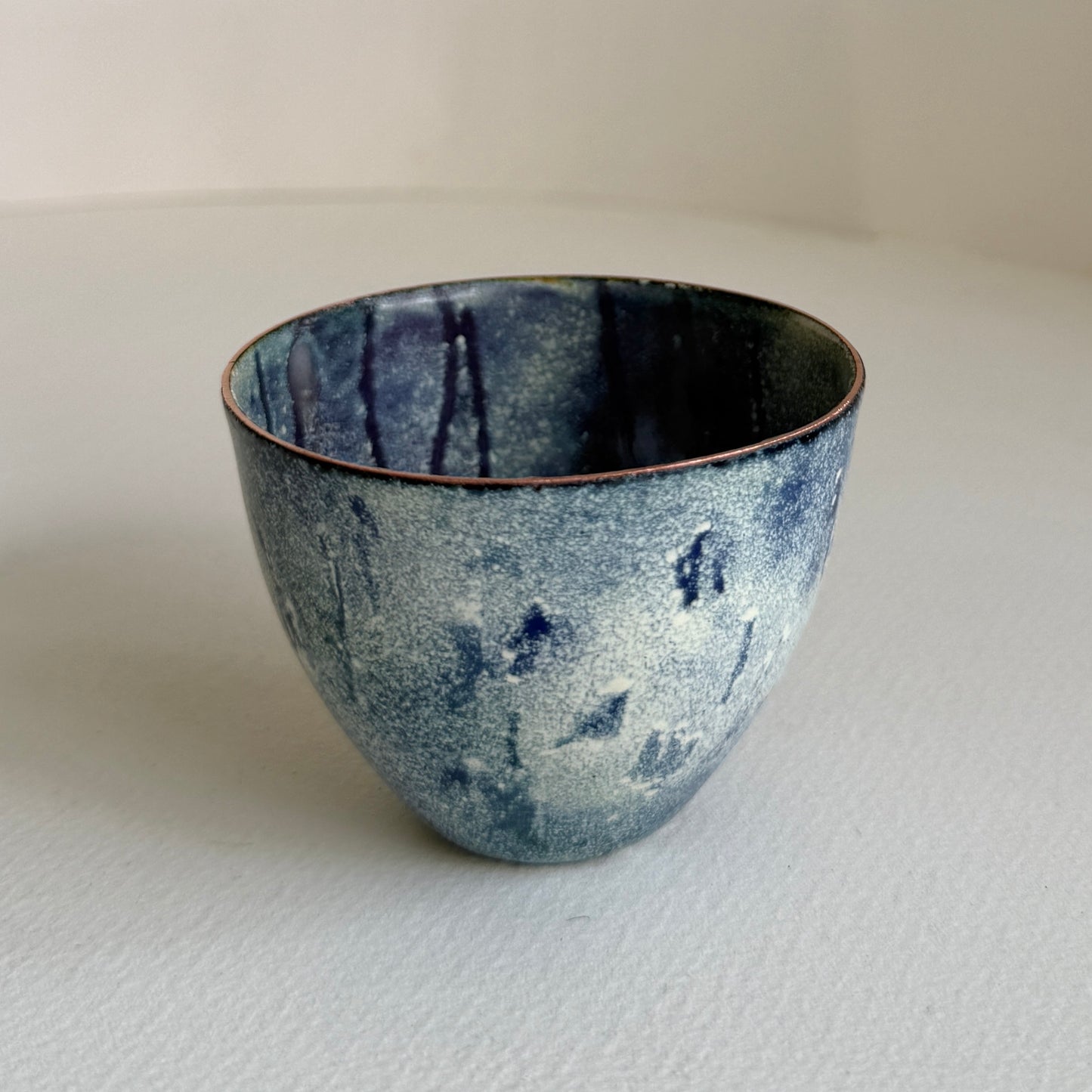 small decorative vessel in copper and enamel